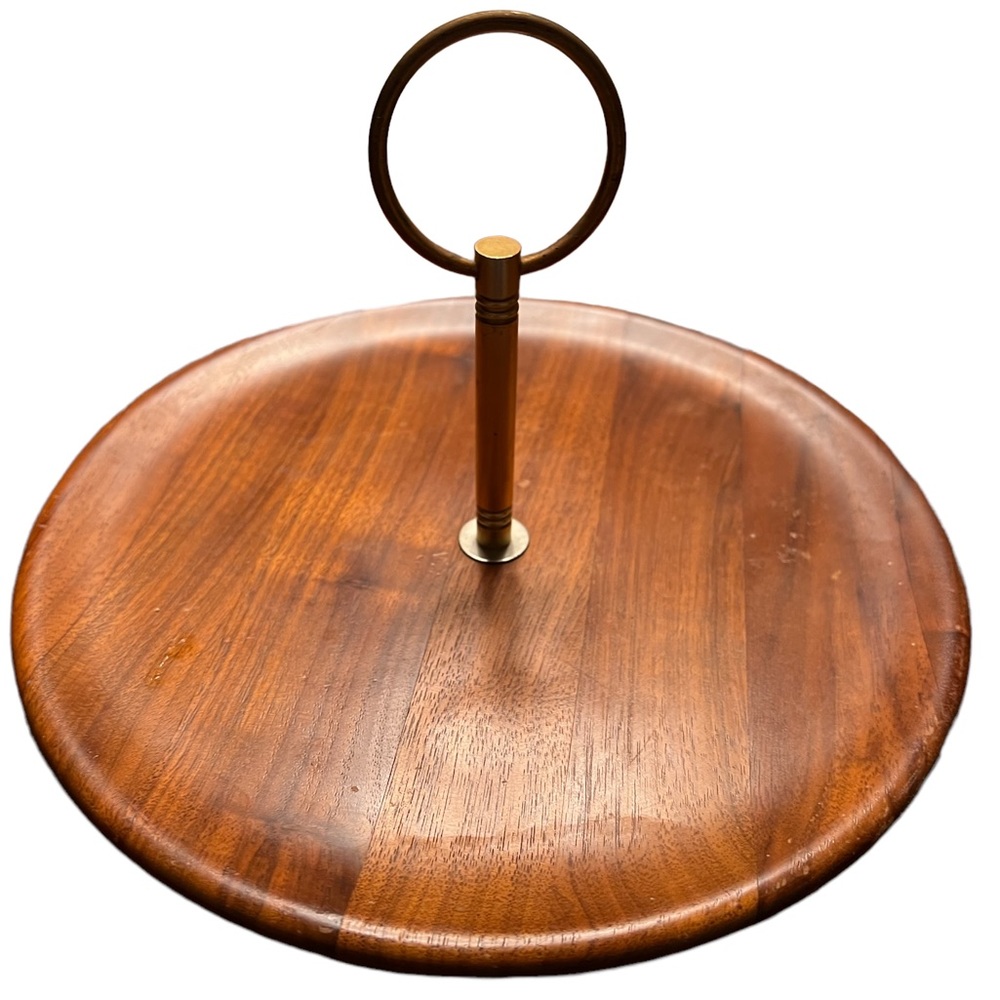 Vintage serving tray featuring a wooden base and a brass-toned metal handle